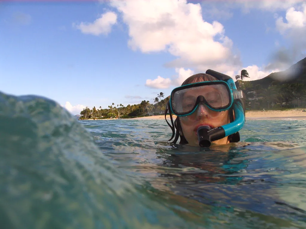 Snorkeler in a mask near the beach